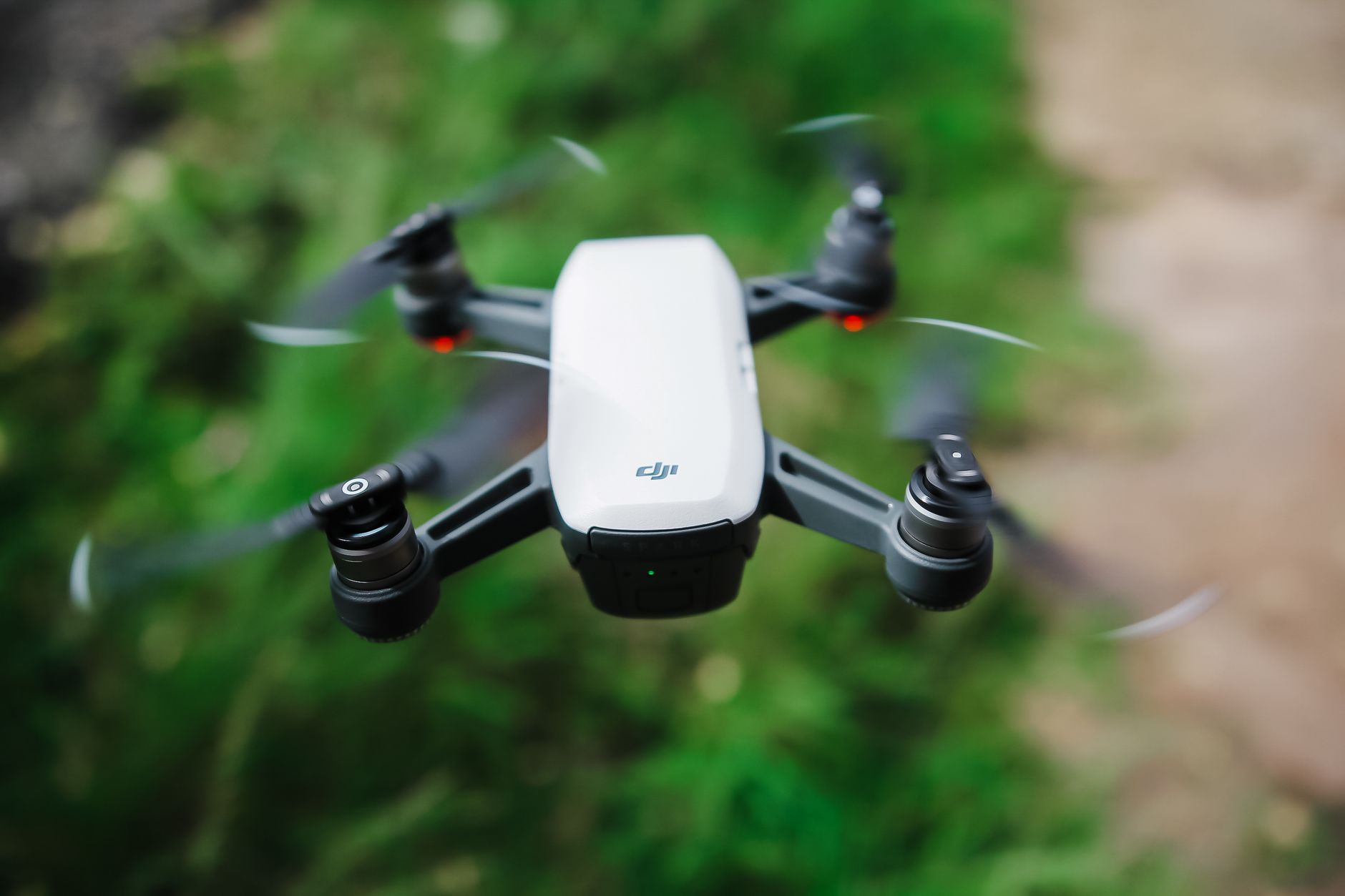 Person holding a compact drone controller with smartphone attached