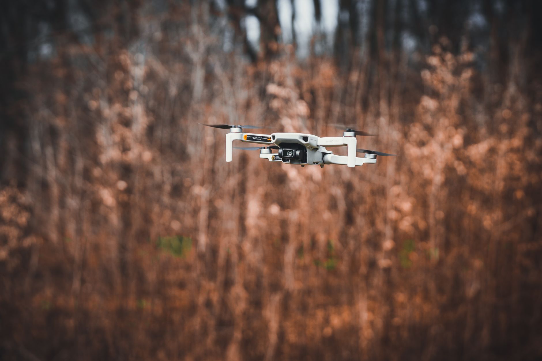 Thermal drone flying over a forest during deer recovery operation