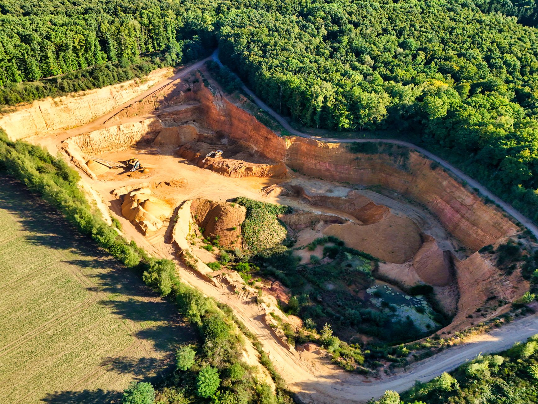 Commercial drone flying near industrial structure