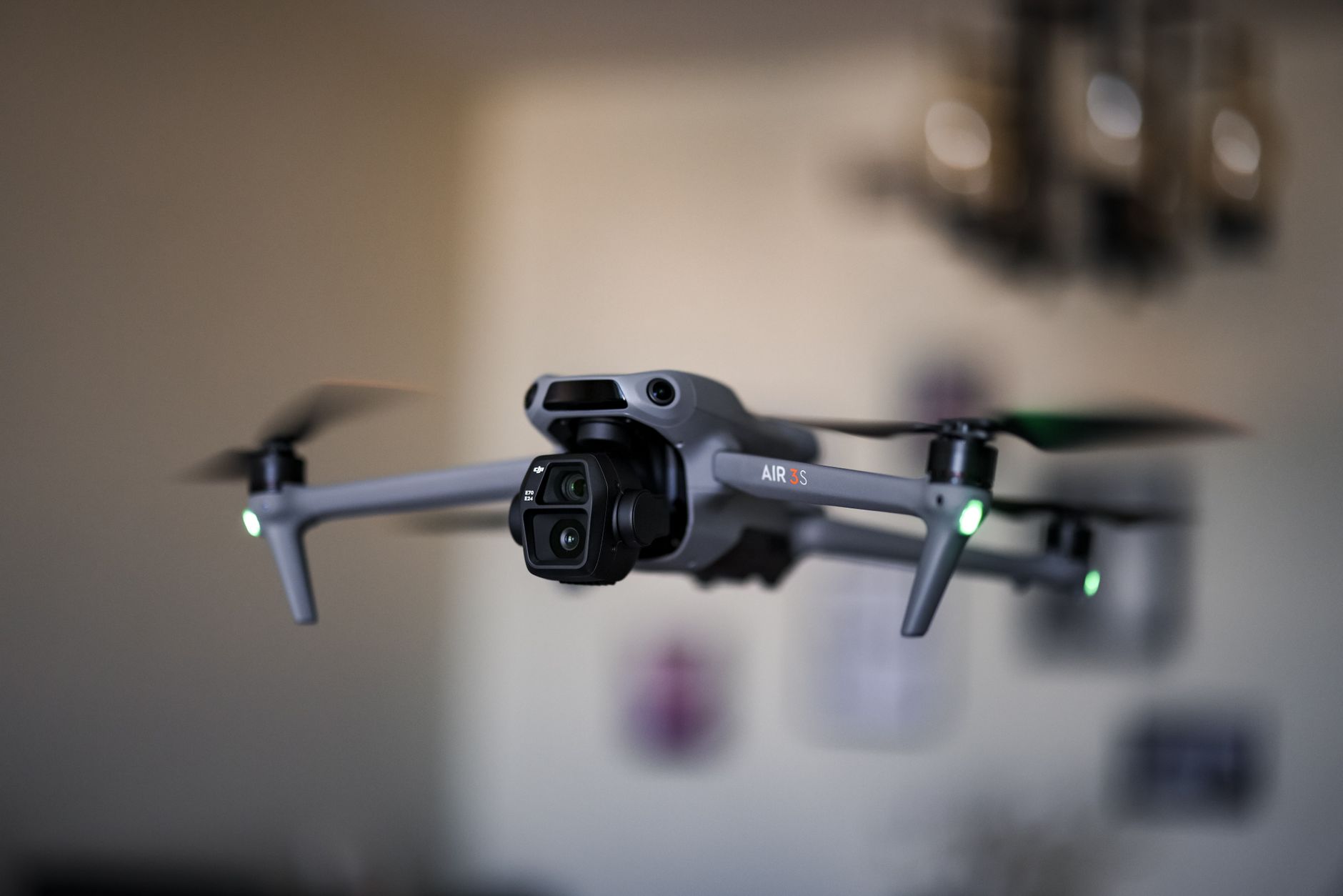DJI Air 3S hovering over coastal road while tracking a car