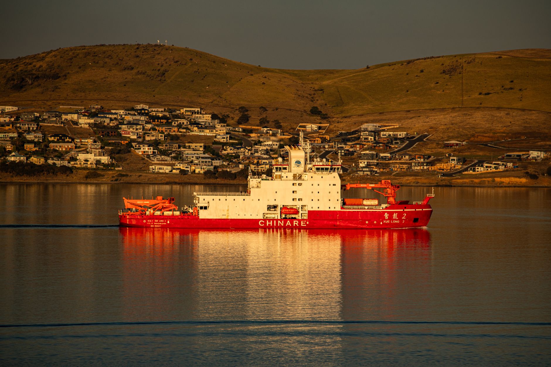 Open frame underwater ROV being lowered from a small boat into the sea